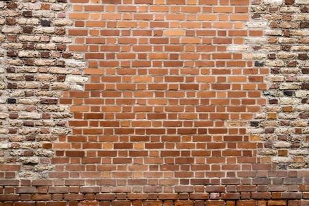 Old damaged brick wall texture background. Close up.