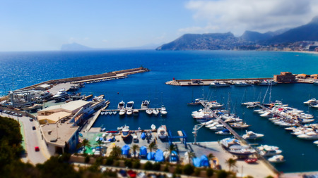 Calpe. Spain. Panorama of the marina with yachts on the background of the city and hills. Selective focus. Toned imageの写真素材