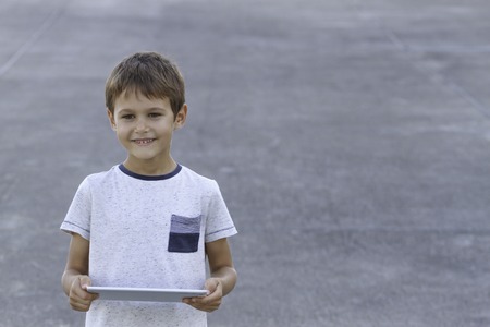 Smiling boy with tablet PC. Childhood, education, learning technology leisure concept
