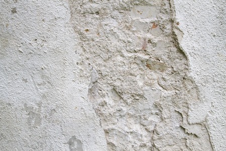 Old white scratched rough concrete wall texture for backgroundの写真素材