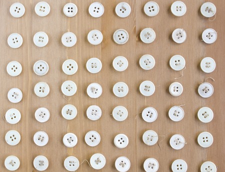 Vintage white sewing buttons as pattern. Flat lay, top viewの写真素材