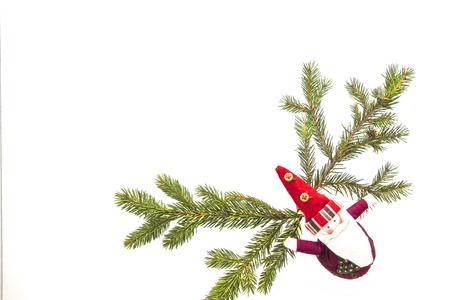 Christmas composition. Green fir twings and Xmas decoration Santa on white background. Top view,...