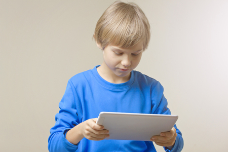 Child with digital tablet computer. Education, learning, leisure conceptの写真素材