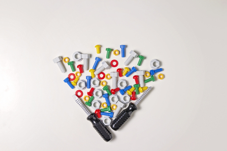 Toys background. Kids construction tools frame on white background. Top view. Flat lay.の写真素材
