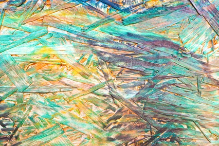 Multicolor painted wood chipboard texture backgroundの写真素材