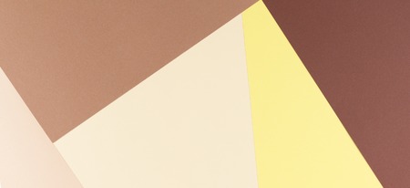 Colorful paper background of yellow, beige, soft and dark brown paper.の写真素材