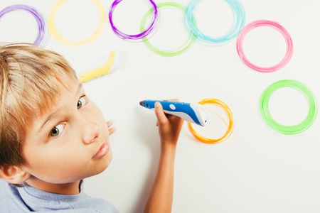 Kid creating with 3d printing pens