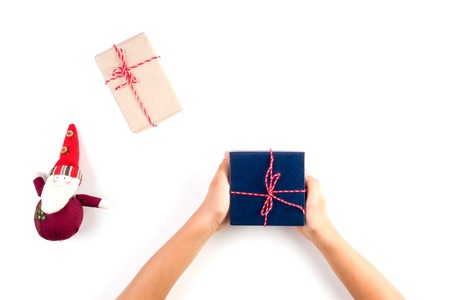 Christmas background. Top view of kid hands holding a present