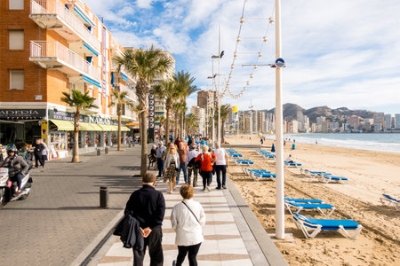 BENIDORM, SPAIN, December 14, 2017: People walking on the embankment of Benidorm, Spainのeditorial素材