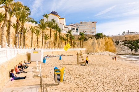 Benidorm, Spain - January 14, 2018: People enjoying holiday in Cala Mas Pas Beach in Benidorm, Alicante, Spain.のeditorial素材