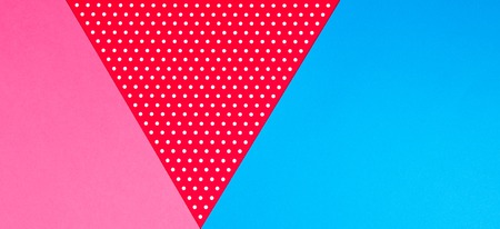 Abstract geometric blue, pink and red polka dot paper background.の写真素材