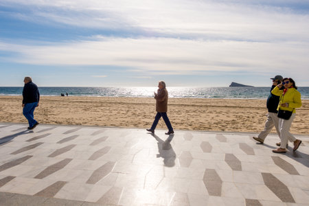 Benidorm, Spain - January 14, 2018: People walking on the promenade, Benidorm, Costa Blanca, Spainのeditorial素材
