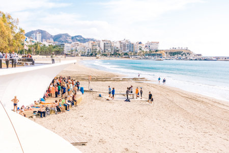Benidorm, Spain, January 29, 2018: People doing exercises on the beach. Healthy lifestyle, active lifestyle retiree in Benidorm, Alicante, Spainのeditorial素材