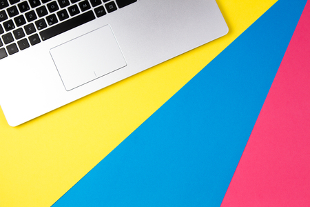 Top view of laptop computer on colorful background.の写真素材