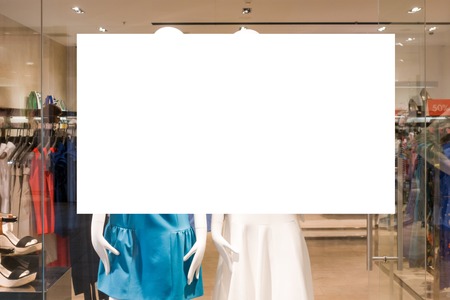 Mock up. Large blank banner in the showcase of clothing store in shopping mallの写真素材