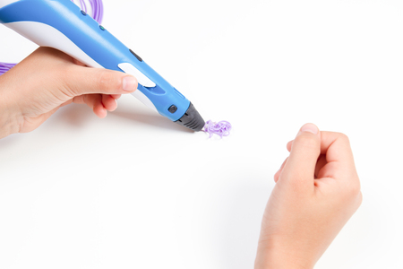 Kid hands with blue yellow 3d pen.