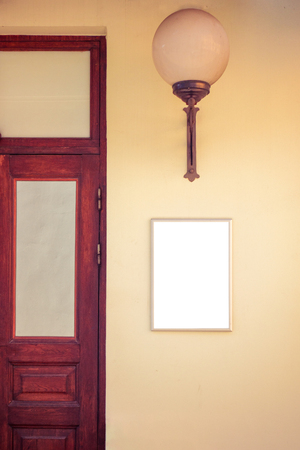Mock up. Blank signboard on the wall near entrance to shop, store, restaurant or hotelの写真素材