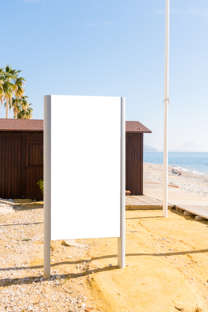 Mock up. Blank billboard outdoors, outdoor advertising, public information board in the beachの写真素材