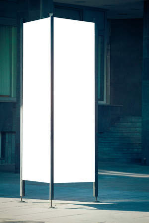 Mock up. Blank outdoor advertising column outdoors, public information board in the city.の写真素材