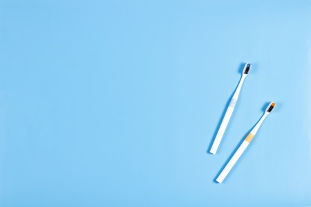 Toothbrushes on blue background. Top viewの写真素材