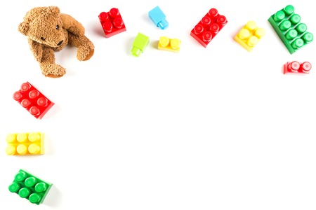 Kids toys background with teddy bear and colorful blocksの写真素材