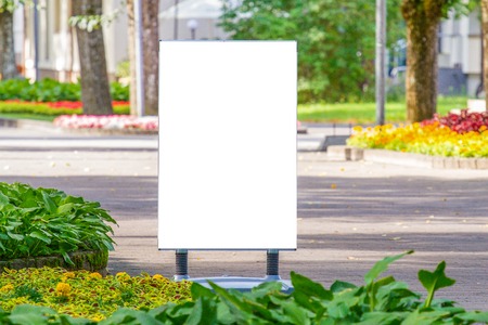Mock up. Outdoor advertising, blank billboard outdoors, public information board in the parkの写真素材