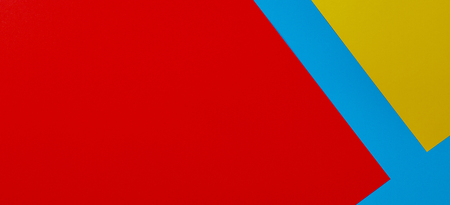 Color papers geometry flat composition background with yellow red and blue tonesの写真素材