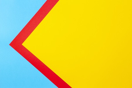 Color papers geometry flat composition background with yellow red and blue tonesの写真素材