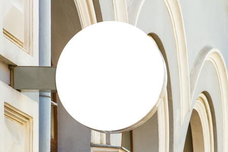 Mock up. Round shape signboard on classical architecture building.の写真素材