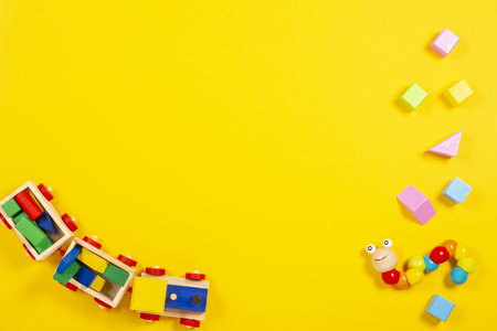 Wooden kid baby toys background with toy train colorful blocksの写真素材