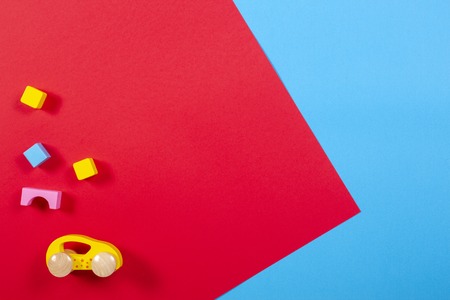Toy car and wooden blocks on colorful backgroundの写真素材
