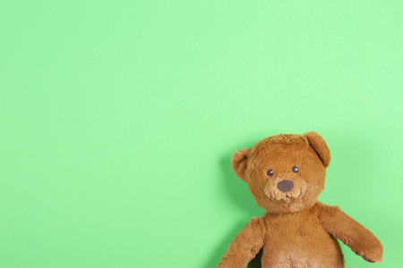 Teddy bear toy on green backgroundの写真素材