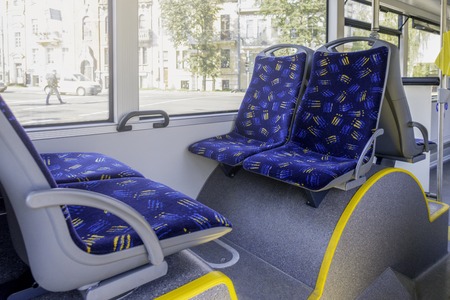City vehicle bus salon with empty passangers seatsの写真素材