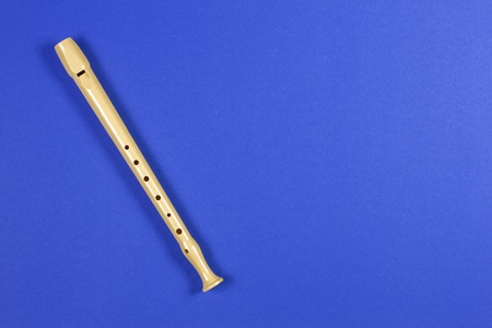 Musical instrument flute on blue color background.の写真素材