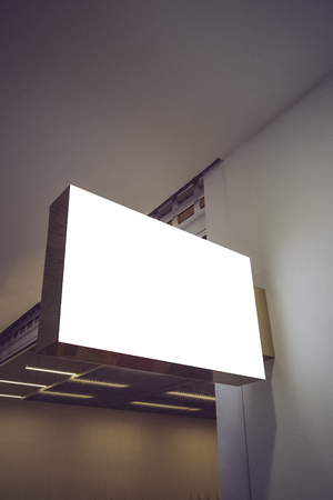 Horizontal rectangular white empty signage mock up of store, shop in shopping mallの写真素材