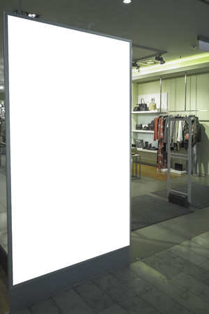 Mock up. Billboard banner, store showcase window od clothing store inside shopping mallの写真素材
