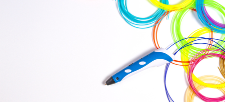 3d pen with colourful plastic filament on white background