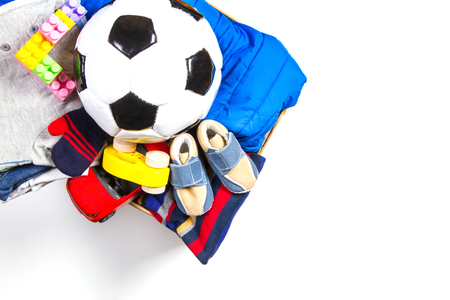 Donation box with toys, books, clothing for charity on white backgroundの写真素材