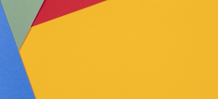 Geometric flat lay yellow green blue red color paper backgroundの写真素材