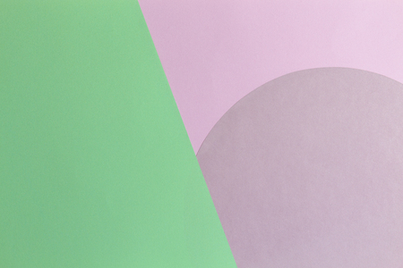 Abstract color paper background. Pastel pink and light green color round circle shape geometry composition. Top viewの写真素材