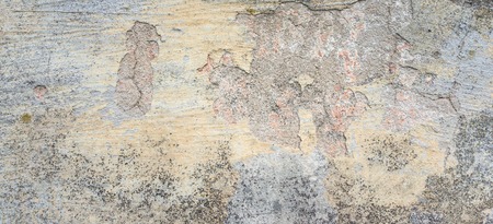 Old wall with peel grey stucco texture. Retro vintage worn dirty wall surface. Decayed cracked rough...