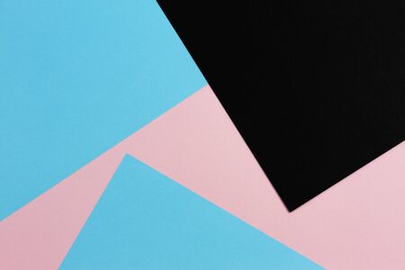 Abstract geometric shape pastel pink, light blue and black color paper backgroundの写真素材
