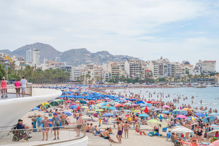 Benidorm, Spain, 16 June, 2019: View of Benidorm Poniente beach full of resting people in Benidorm, Spainのeditorial素材