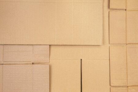 Old used corrugated striped cardboard boxes parts backgroundの写真素材