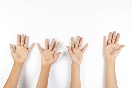 Many kid hands up on white backgroundの写真素材