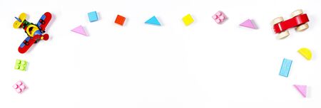 Baby kids toys on white banner background. Top view, flat lay. Copy space for text