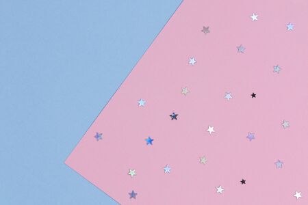 Abstract geometric festive background. Light blue and pastel pink with glitter stars paper...