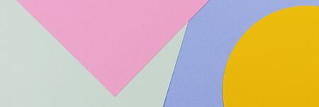 Abstract colored paper texture background. Minimal geometric shapes and lines in blue, light green, yellow, pastel pink coloursの写真素材