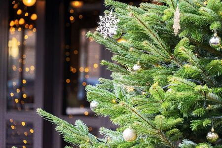 Christmas background. Close-up of Christmas tree with decoration in the city outdoors