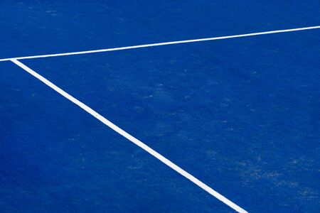 Blue paddle tennis court field with white lines backgroundの写真素材